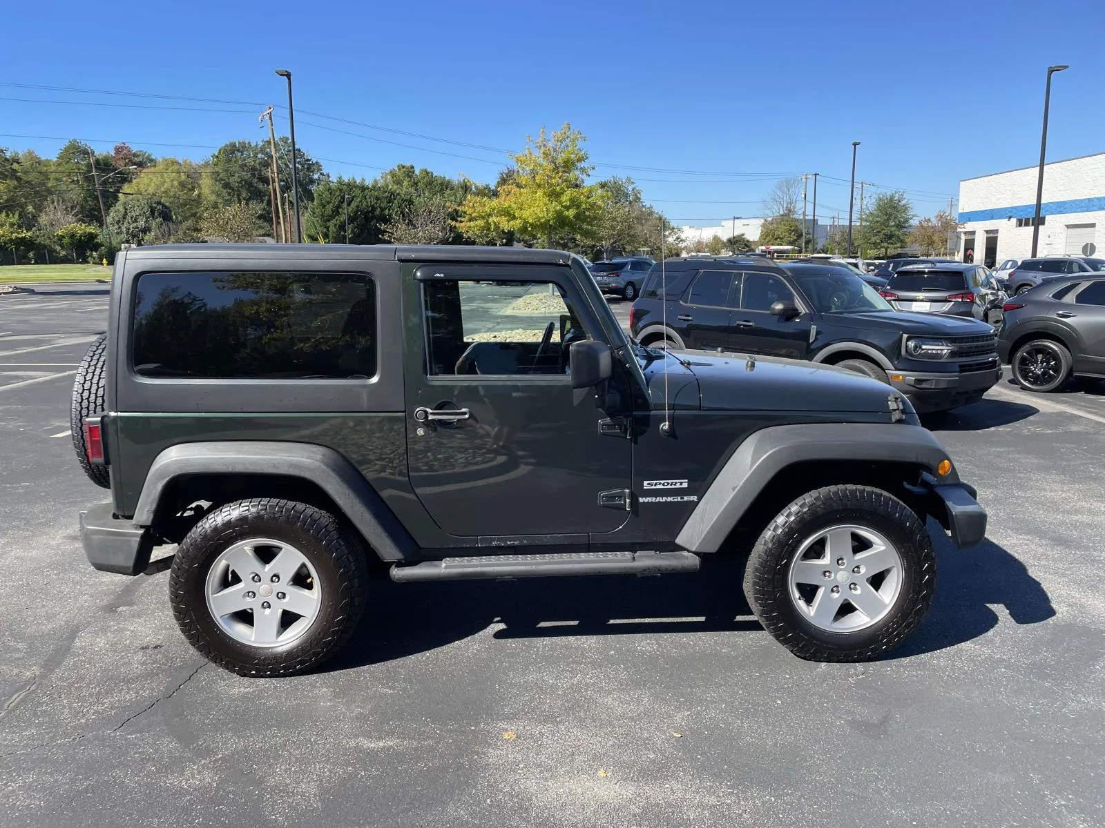 Used 2011 Green Jeep Sport image 8