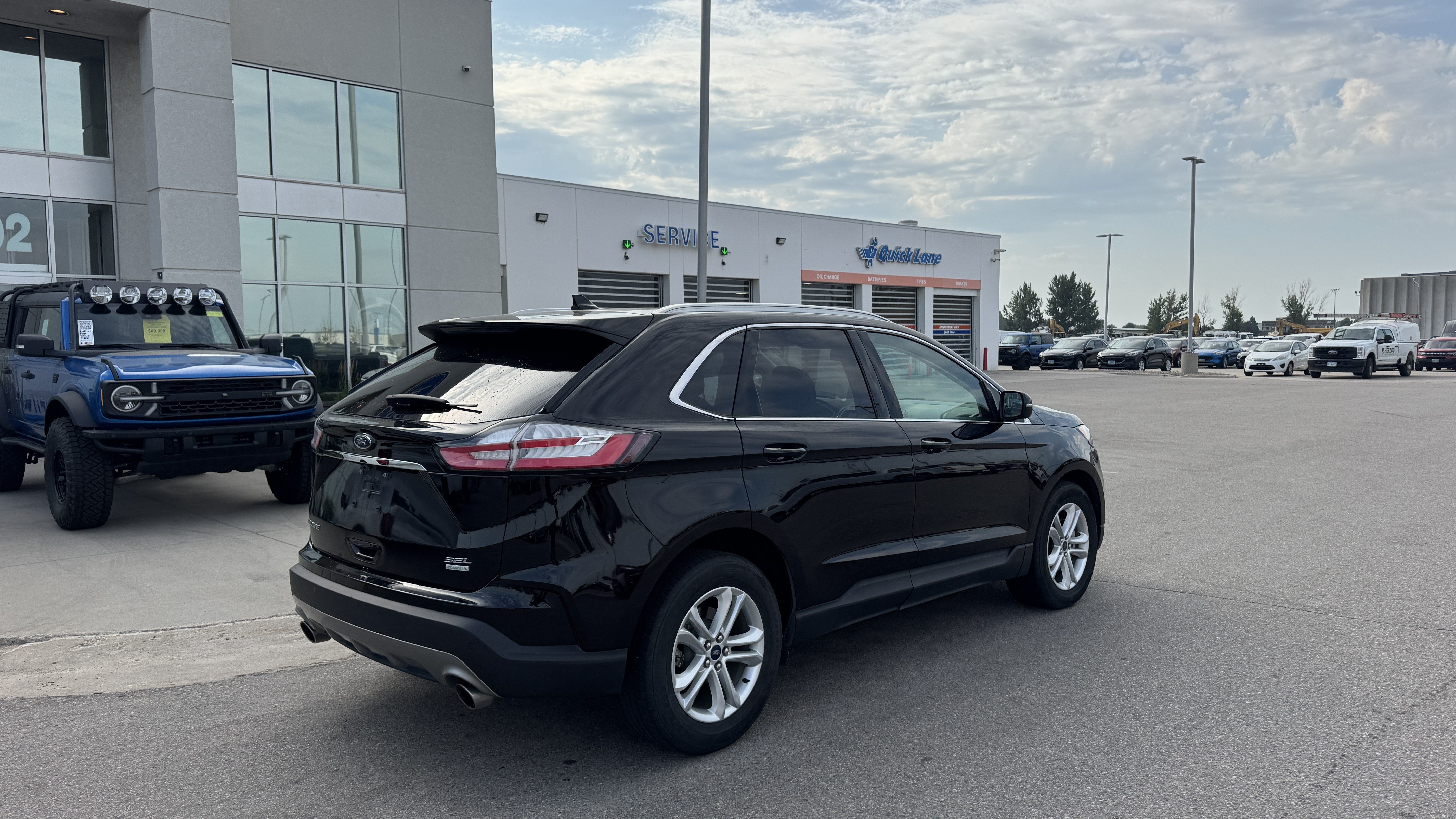 Used 2019 Agate Black Metallic Ford SEL image 4