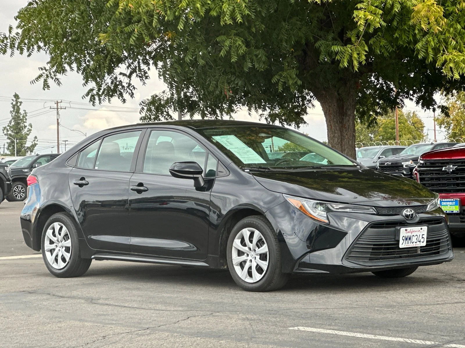 Used 2024 Black Toyota LE image 2