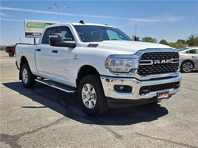 Used 2024 Bright White Clearcoat RAM Big Horn 4x4 Crew Cab 6.3 ft. box 149 in. WB image 4