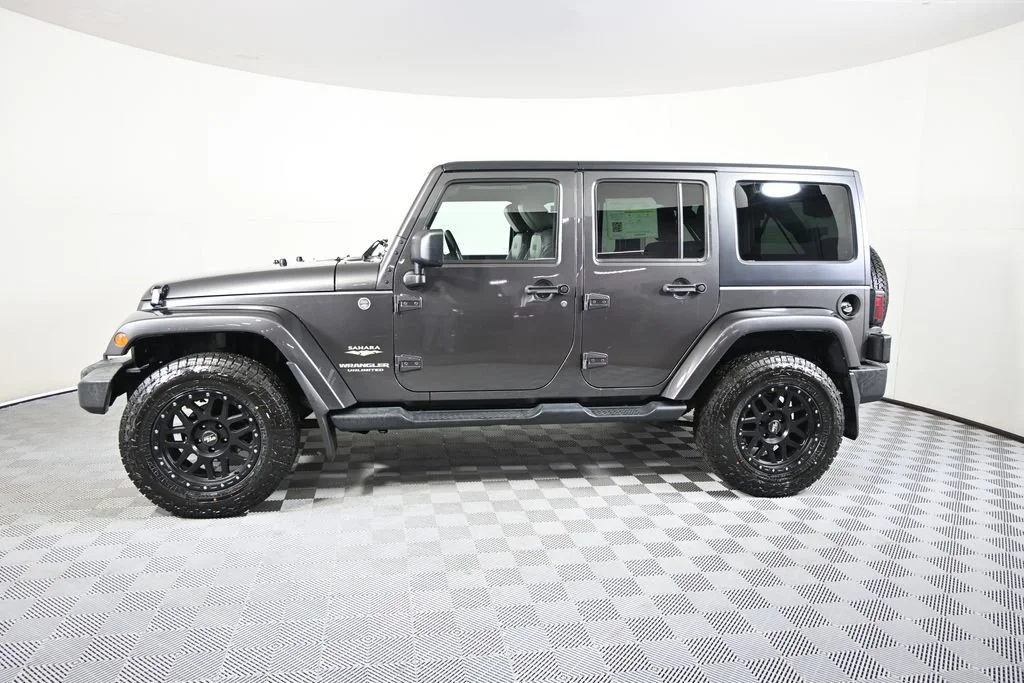 Used 2014 Jeep Wrangler Unlimited Sahara with VIN 1C4HJWEG6EL256674 for sale in Forest Lake, Minnesota