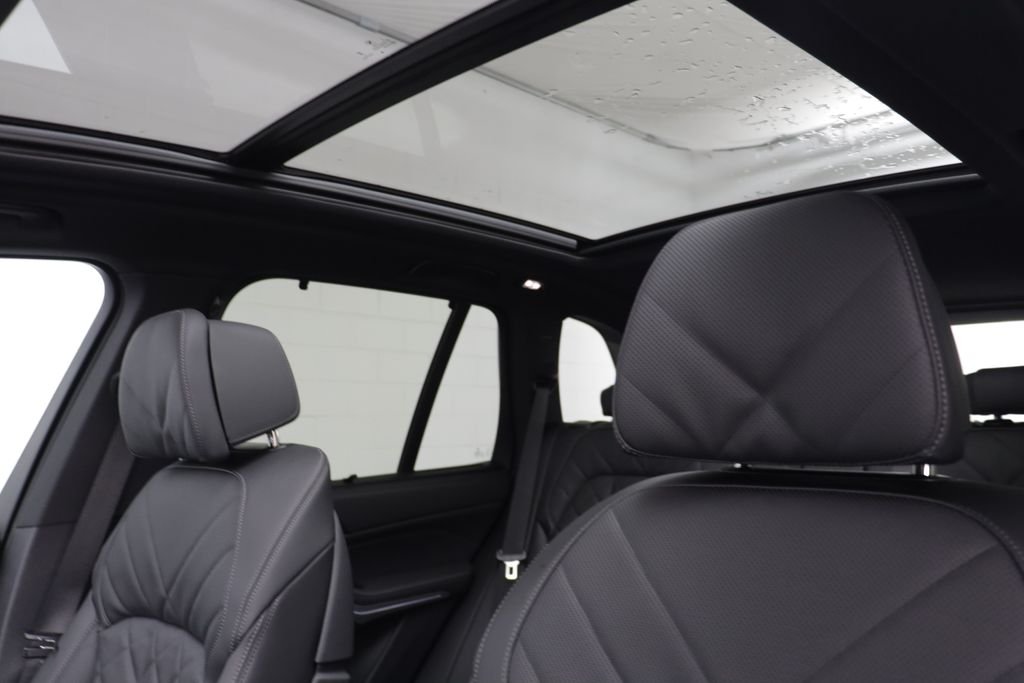 New 2026 Black Sapphire Metallic BMW xDrive50e image 14