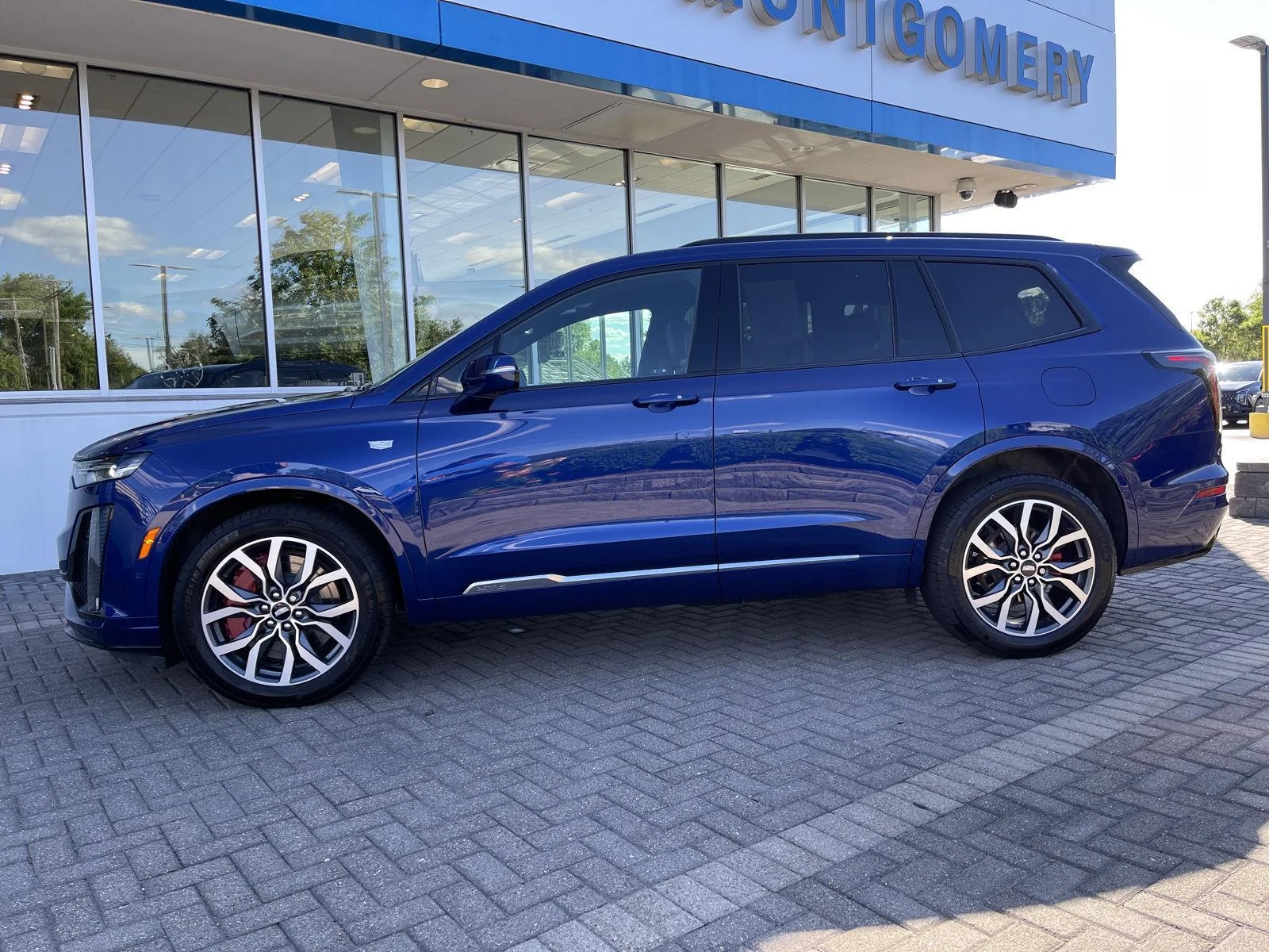 Used 2024 Opulent Blue Metallic Cadillac Sport image 2