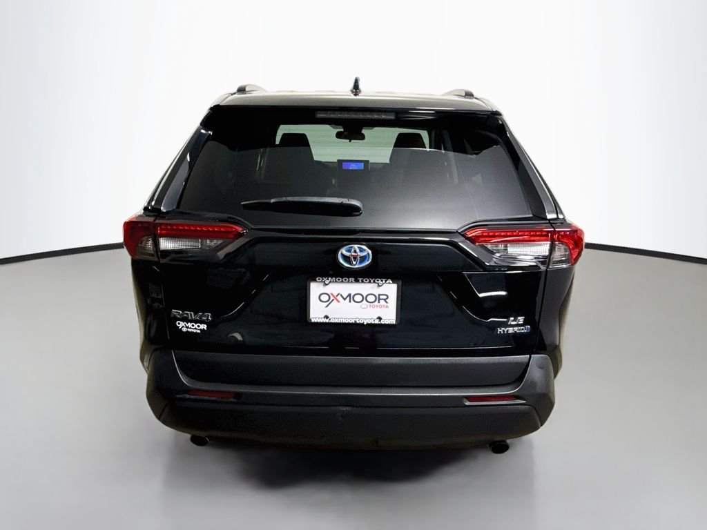 Used 2024 Midnight Black Metallic Toyota Hybrid LE image 6