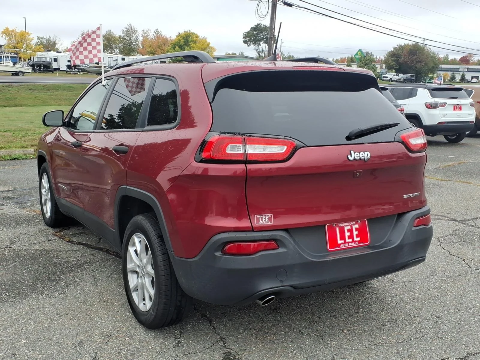 Used 2017 Deep Cherry Red Crystal Jeep Sport image 6