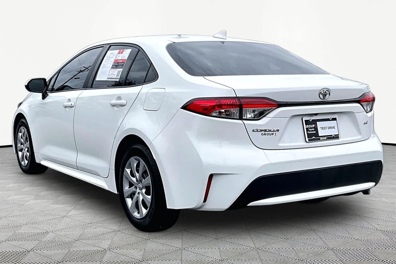 Used 2021 Super White Toyota LE image 12