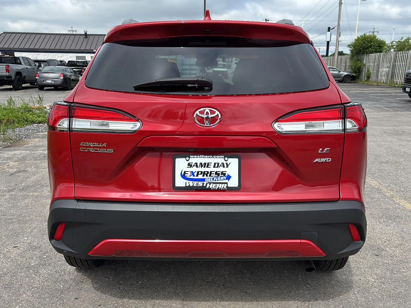 Used 2023 Barcelona Red Metallic Toyota LE image 6