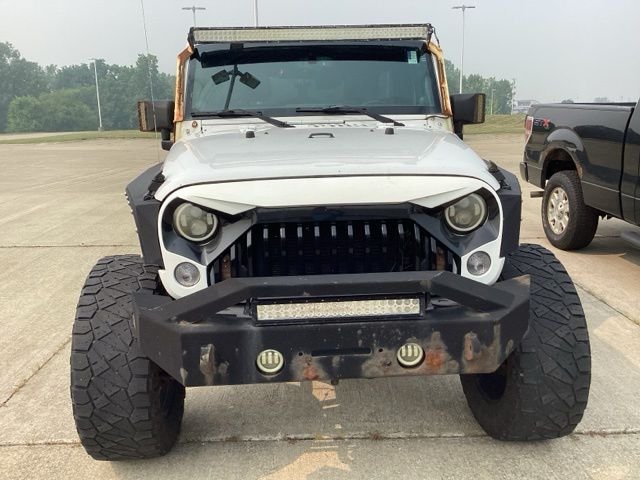 Used 2014 Jeep Wrangler Unlimited Rubicon with VIN 1C4HJWFGXEL325610 for sale in Sheffield, OH