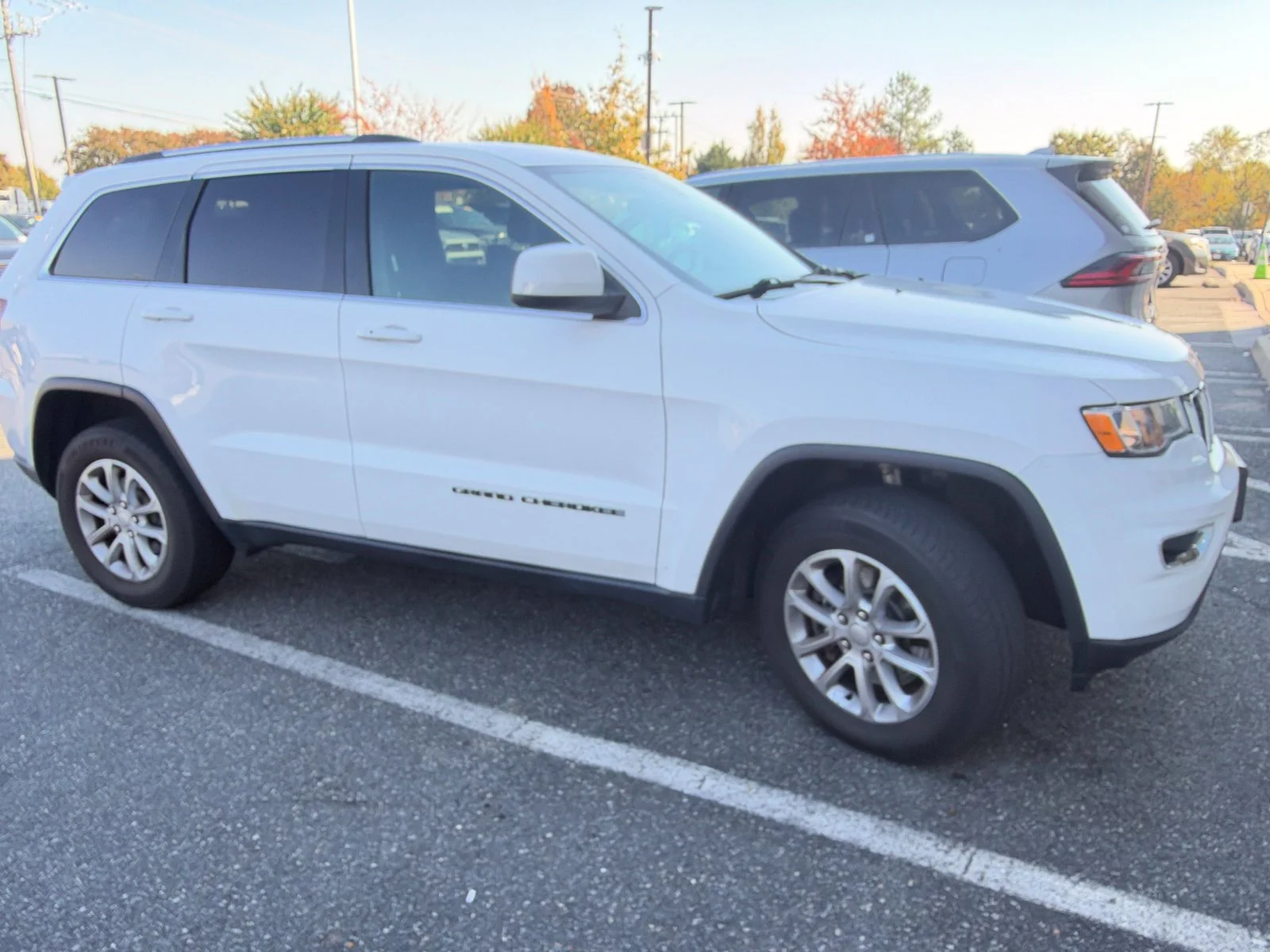 Used 2021 White Jeep Laredo E image 1