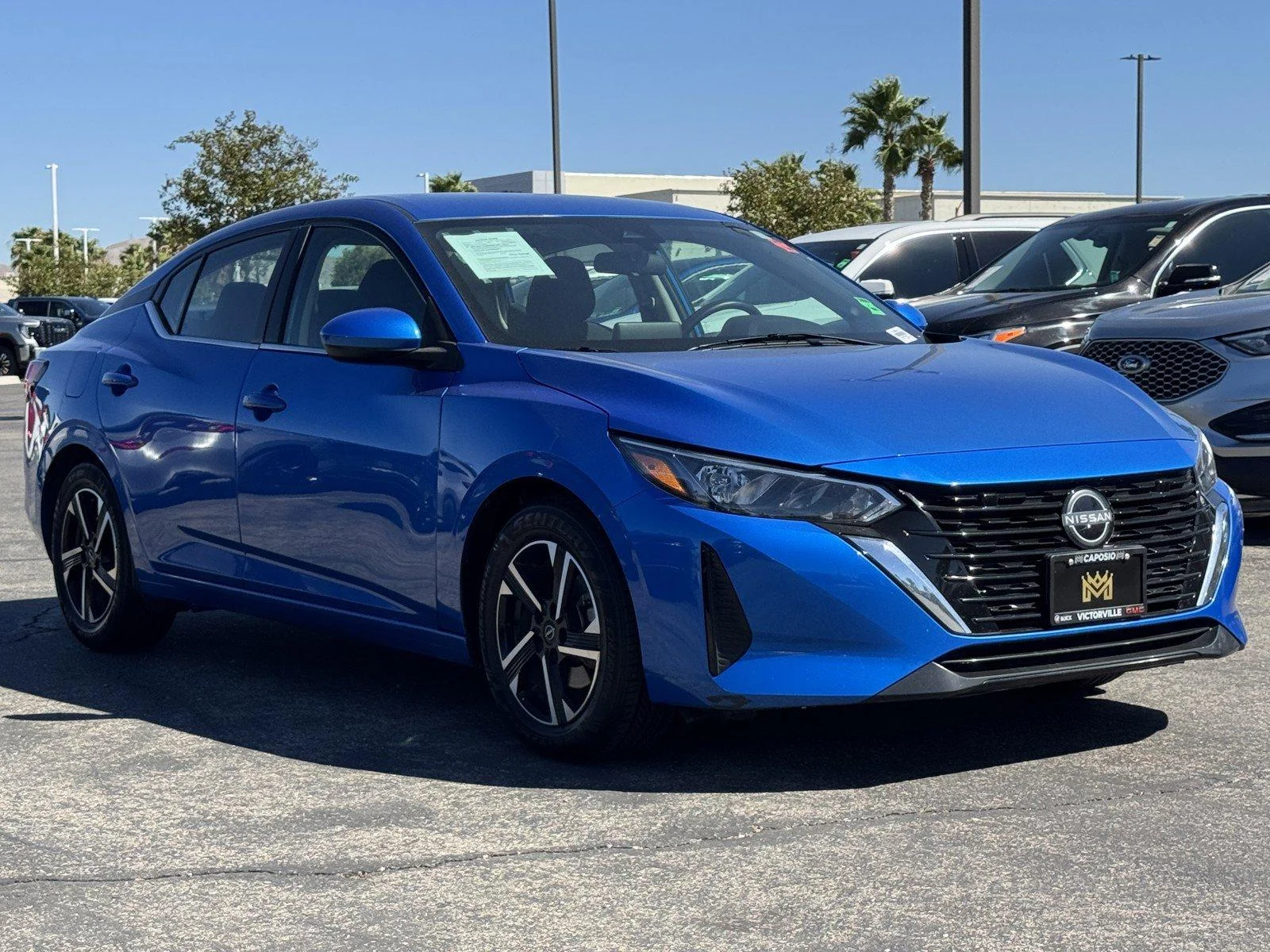 Used 2024 Electric Blue Met Nissan SV image 1