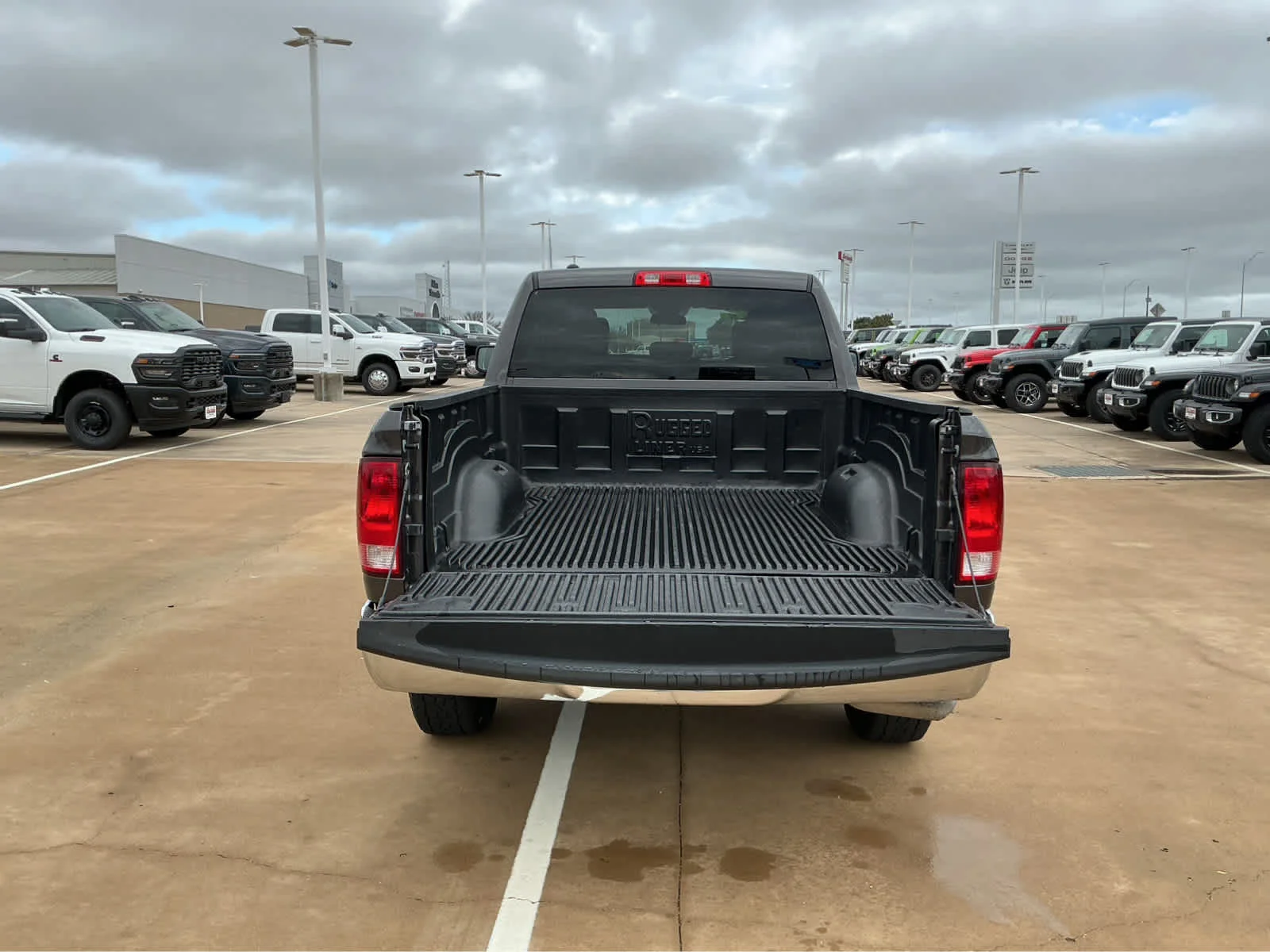 Used 2024 Granite Crystal Metallic Clearcoat Ram SLT image 12