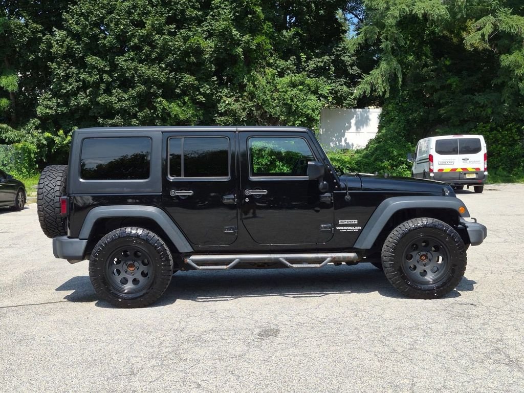 Used 2016 Black Jeep Unlimited Sport image 2