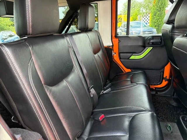 Used 2013 Orange Jeep Unlimited Rubicon image 23