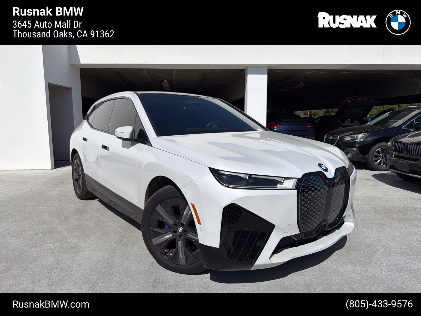 Used 2024 Mineral White Metallic BMW xDrive50 image 1
