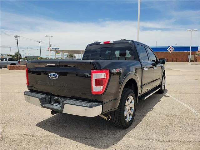 Used 2023 Agate Black Metallic Ford Lariat 4x4 SuperCrew Cab 6.5 ft. box 157 in. WB image 4