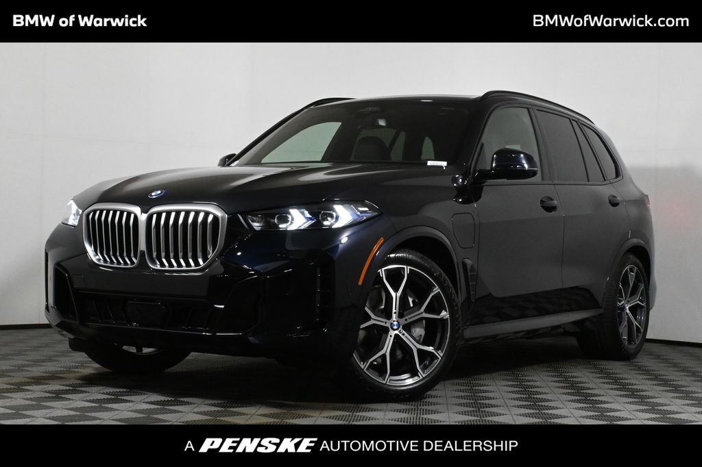Certified Used 2026 Carbon Black Metallic BMW xDrive50e image 1