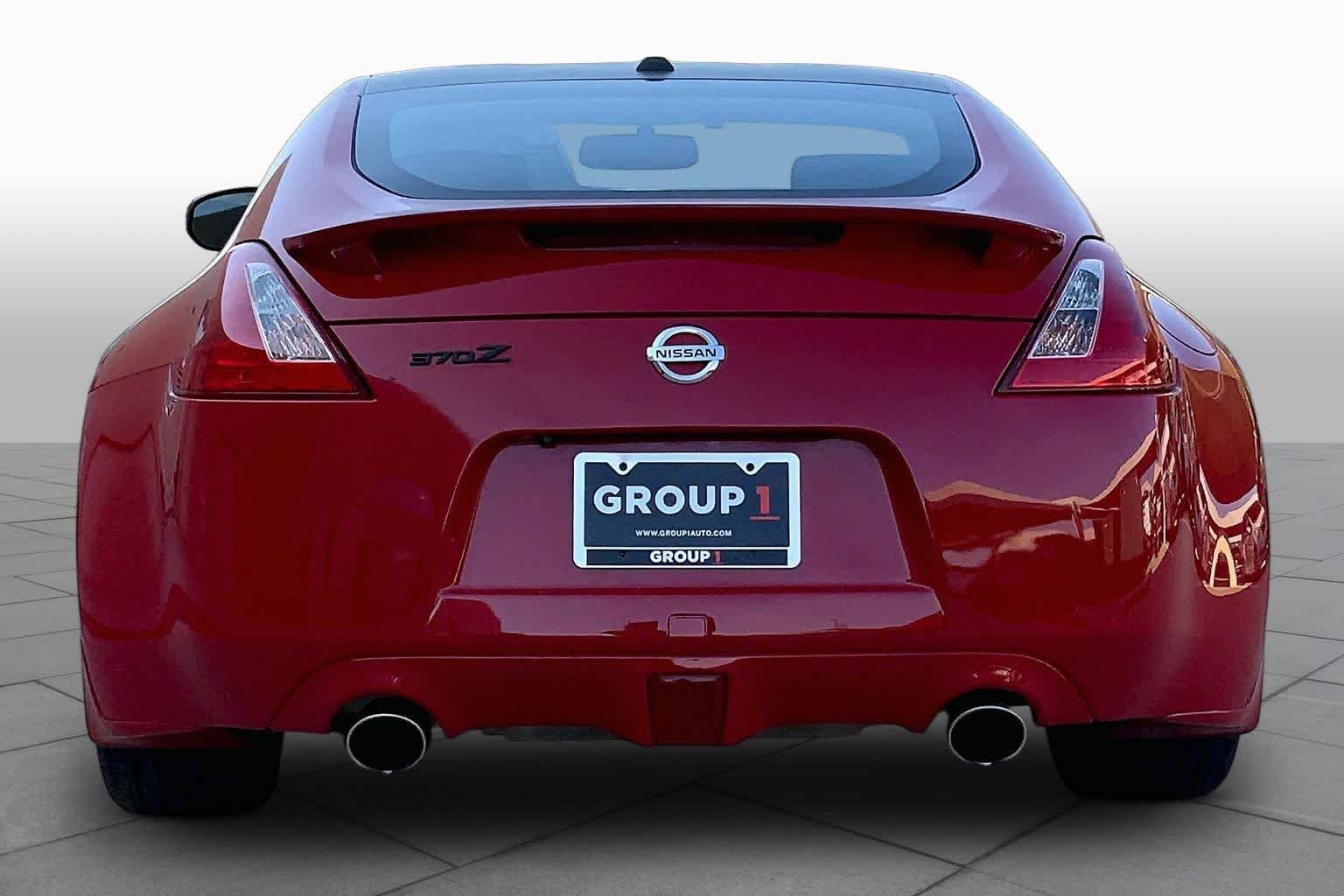 Used 2016 Solid Red Nissan Touring image 5