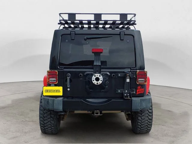 Used 2012 Black Jeep Unlimited Sahara Altitude image 4
