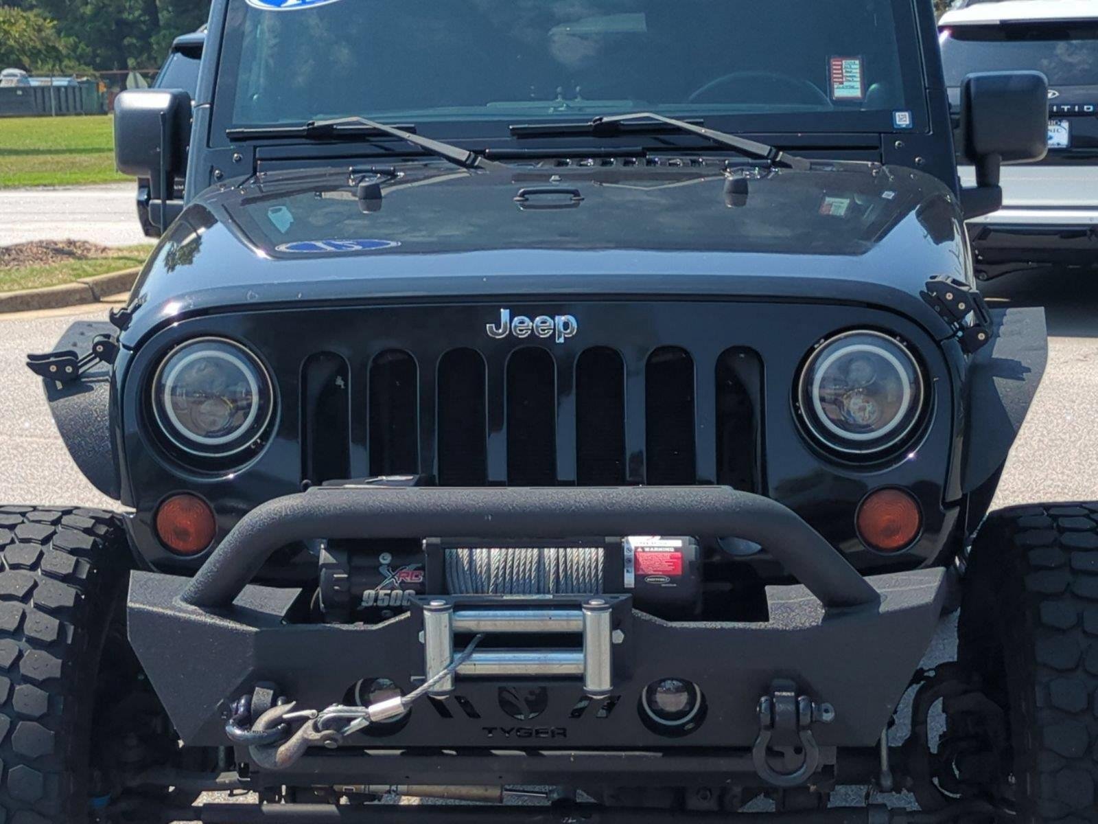 Used 2012 Black Clearcoat Jeep Sahara image 13