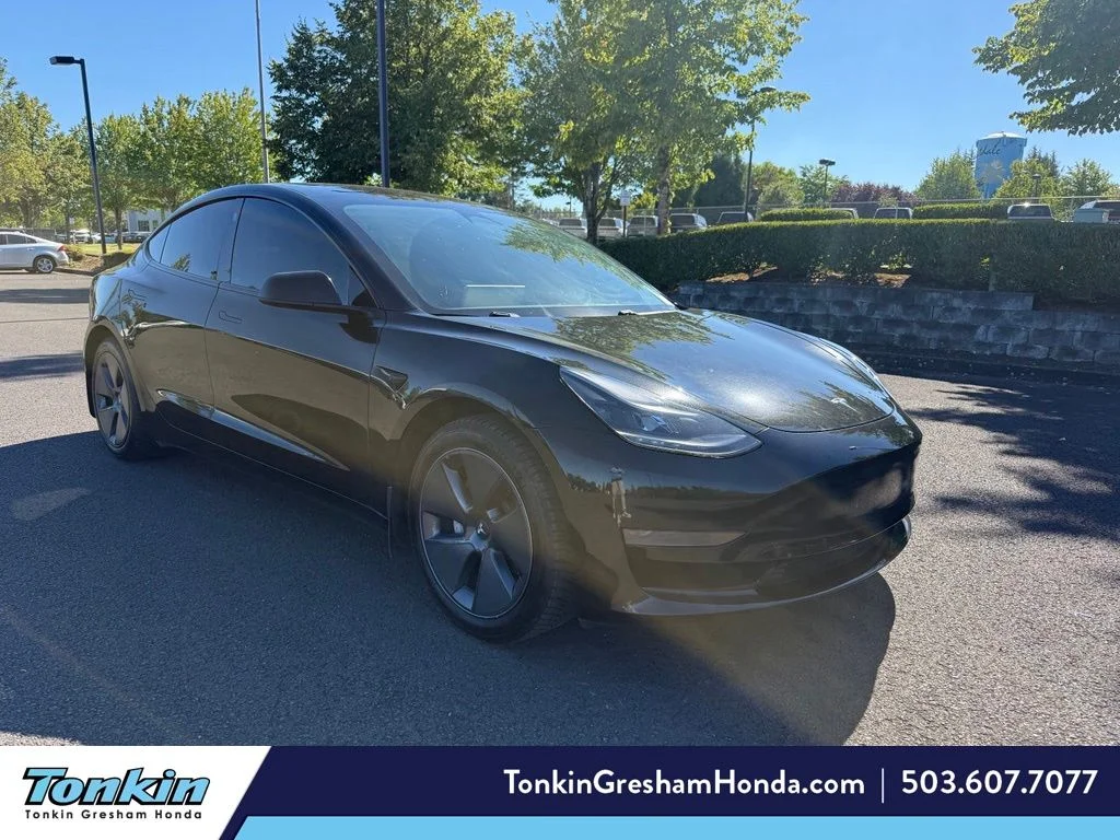 Used 2021 Solid Black Tesla Standard Range Plus image 1