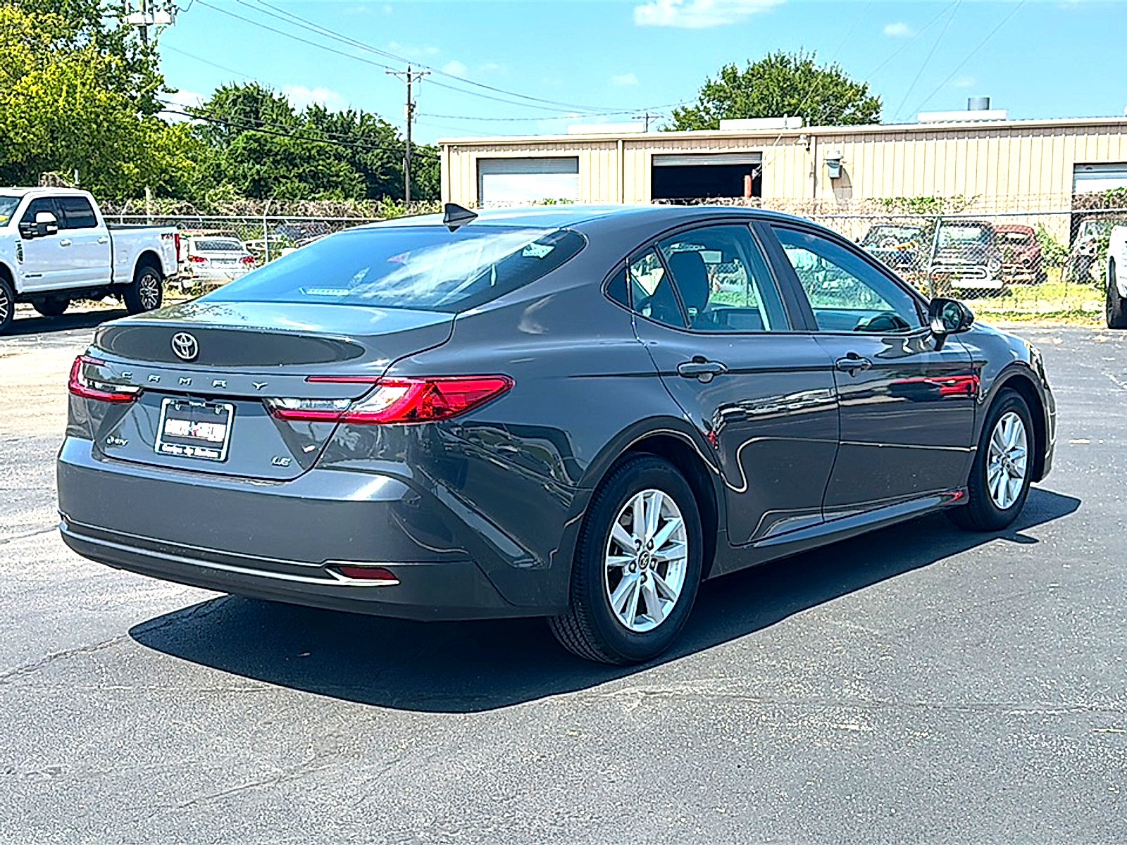 Used 2025 Super Black Toyota LE image 8