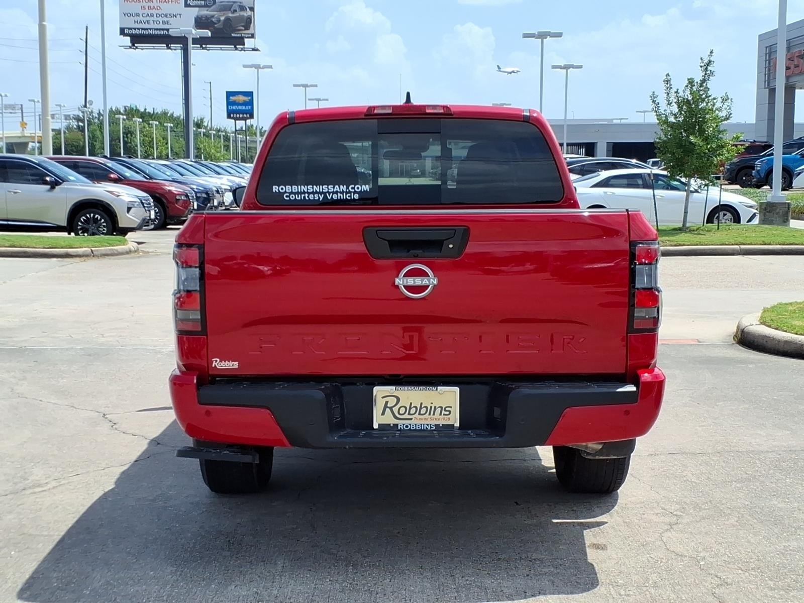 2026 Nissan Frontier SV Red at Robbins Nissan