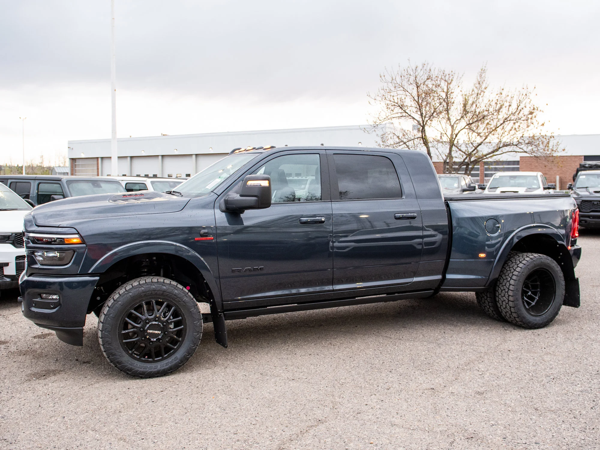 Used 2026 Blue RAM Limited* Mega Cab, 20 Inch Mayhem Wheels, Trigger Industries Mudflaps image 4