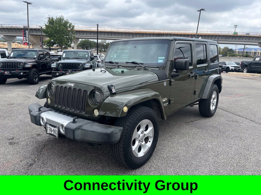 Used 2015 Green Jeep Unlimited Sahara image 3
