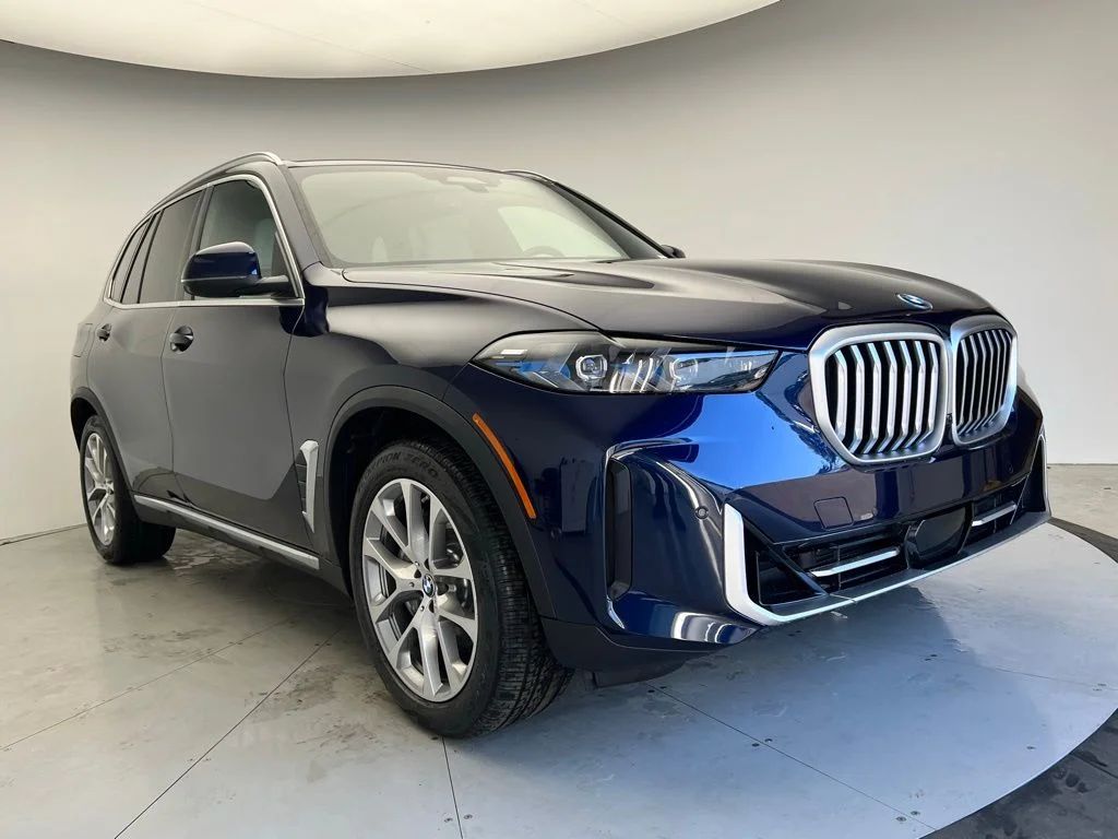 Used 2026 Tanzanite Blue II Metallic BMW xDrive50e image 2
