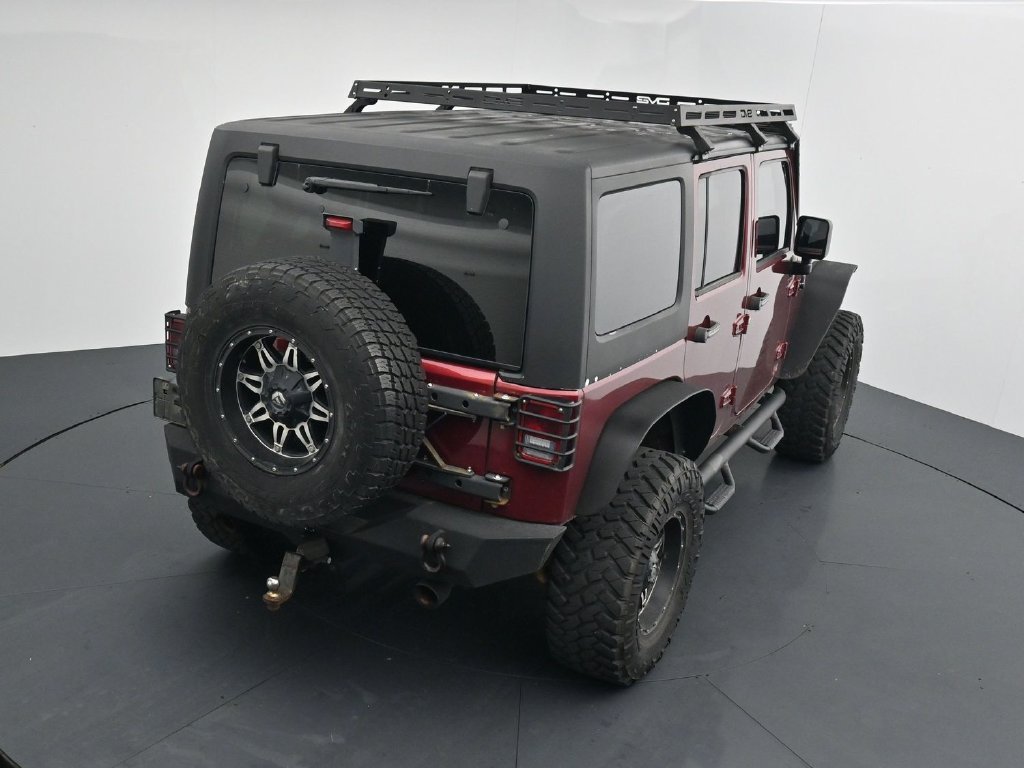 Used 2012 Red Jeep Unlimited Sport image 15