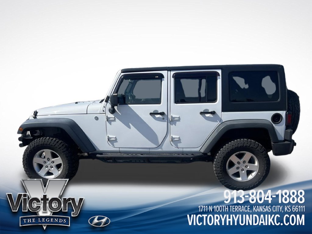 Used 2013 White Jeep Unlimited Sport image 2