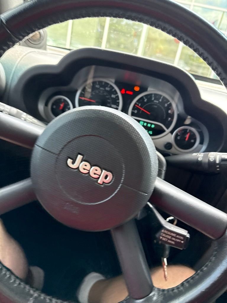Used 2010 Gray Jeep Unlimited Sport image 18