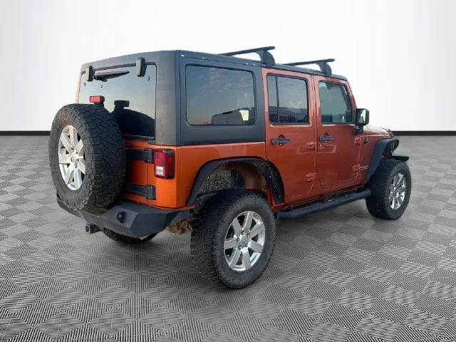 Used 2011 Orange Jeep Unlimited Rubicon image 4