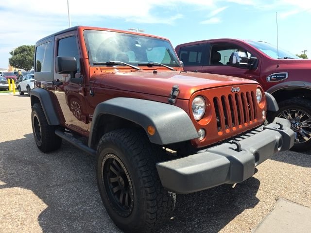 Used 2014 Orange Jeep Sport image 1