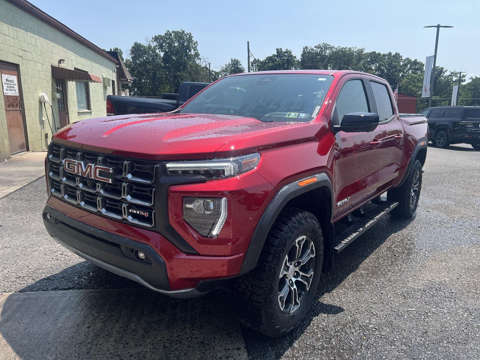 Used 2024 Volcanic Red Tintcoat GMC 4WD AT4 image 7