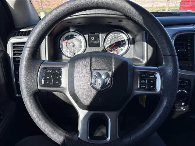 Used 2024 Granite Crystal Metallic Clearcoat RAM SLT 4x4 Quad Cab 6.3 ft. box 140 in. WB image 18