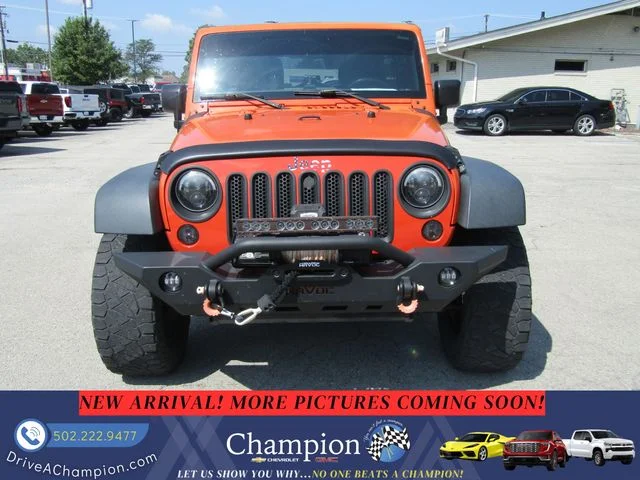 Used 2015 Orange Jeep Unlimited Sport image 2
