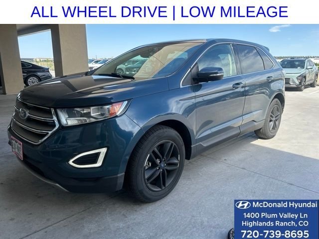 Used 2016 Blue Ford SEL image 1