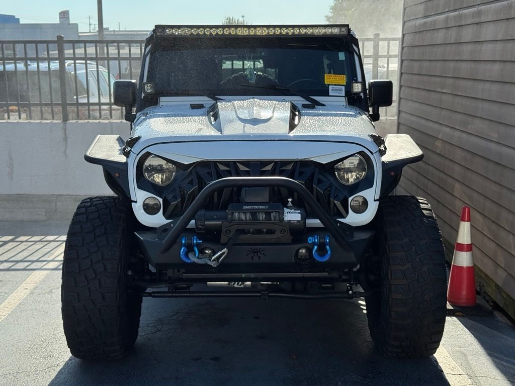 Used 2014 White Jeep Unlimited Sport image 2