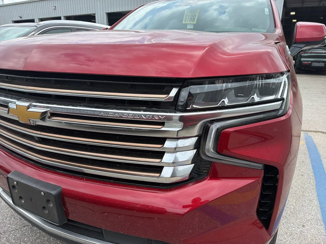 Used 2024 Radiant Red Tintcoat Chevrolet High Country image 1