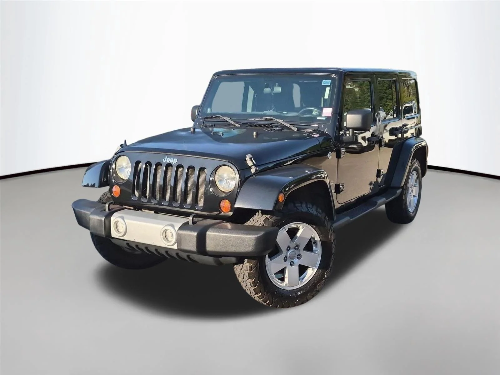 Used 2011 Black Clear Coat Jeep Sahara image 1