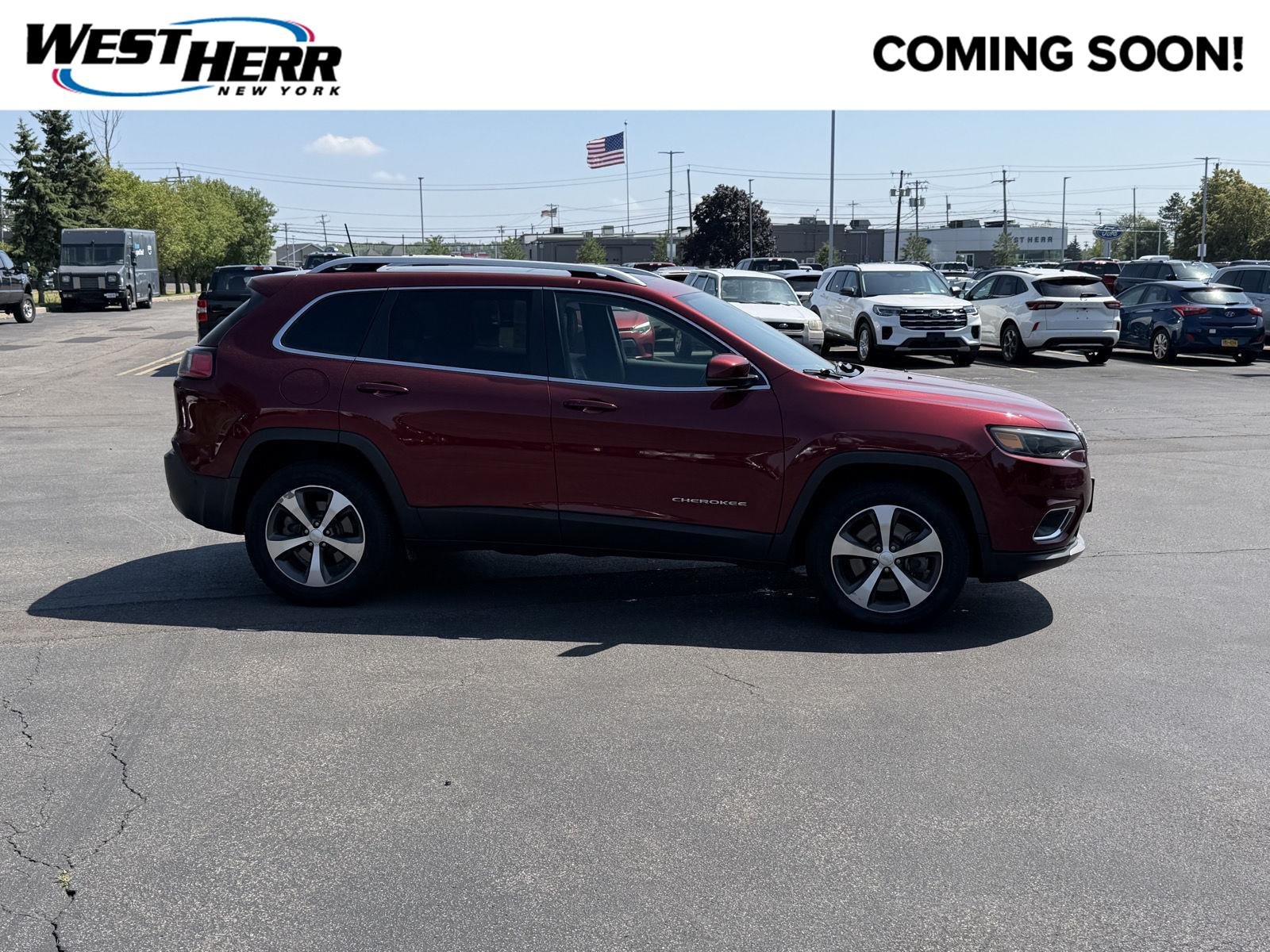 Used 2021 Velvet Red Pearlcoat Jeep Limited image 1