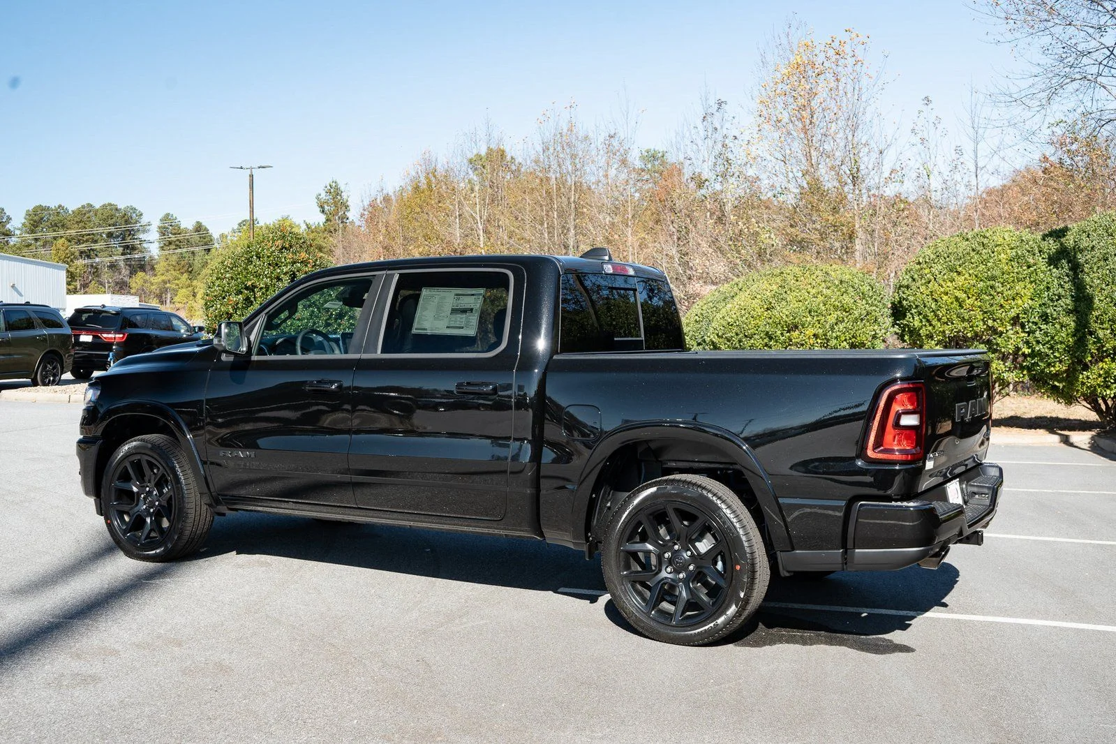 New 2026 Diamond Black Crystal Pearl-Coat Exterior Paint RAM Laramie image 7