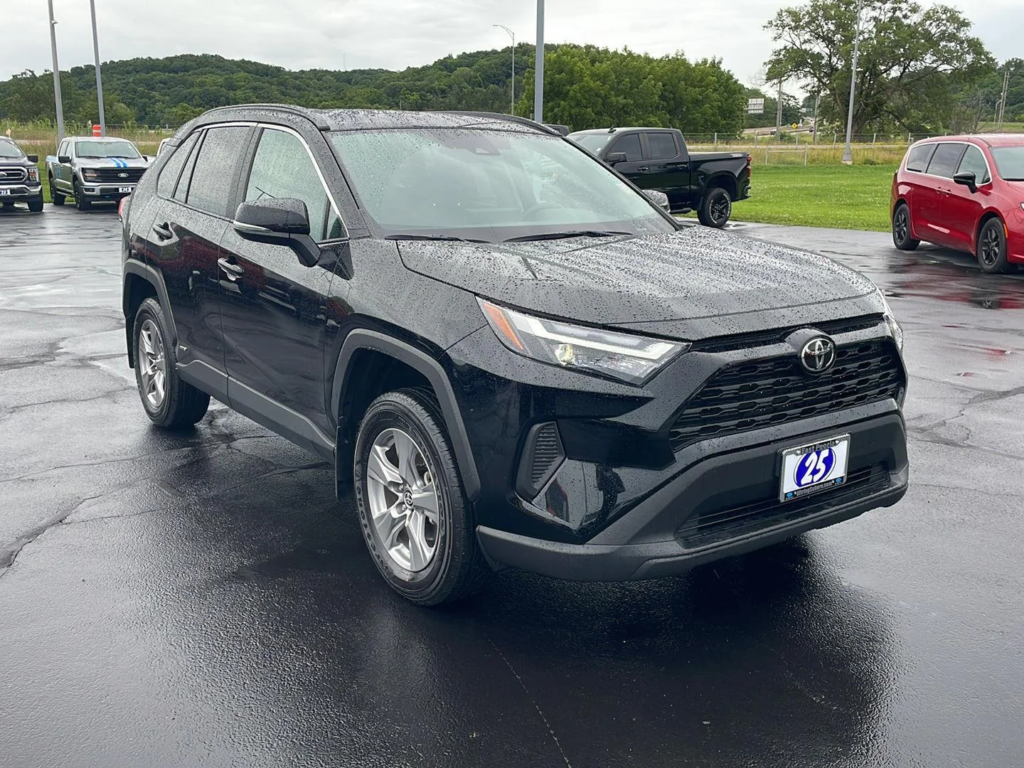 Used 2025 MIDNIGHT BLACK METALLIC TOYOTA TRUCK HYBRID XLE image 7
