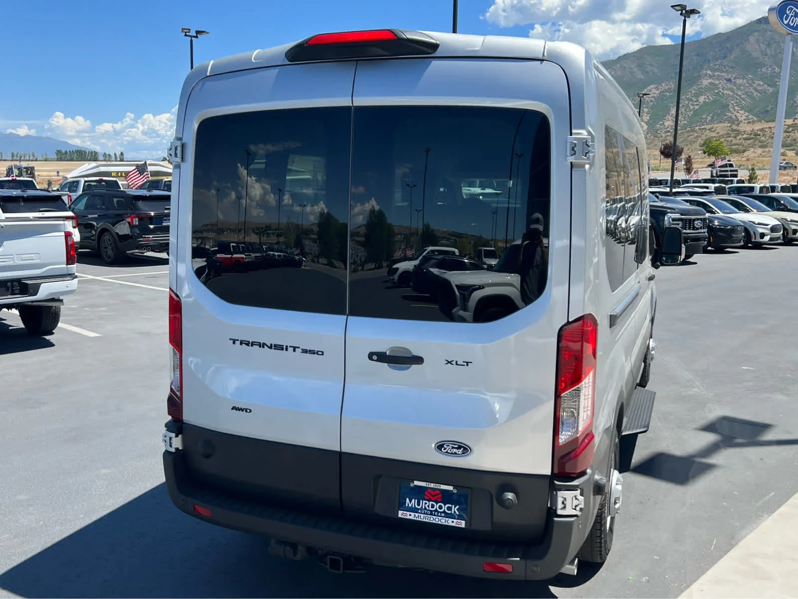 New 2026 Ingot Silver Metallic Ford Passenger Van XLT image 8