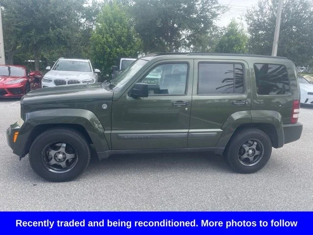 Used 2009 Green Jeep Sport image 1