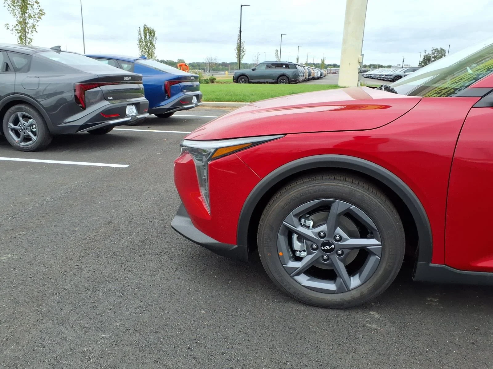 New 2026 Currant Red Kia LXS image 17