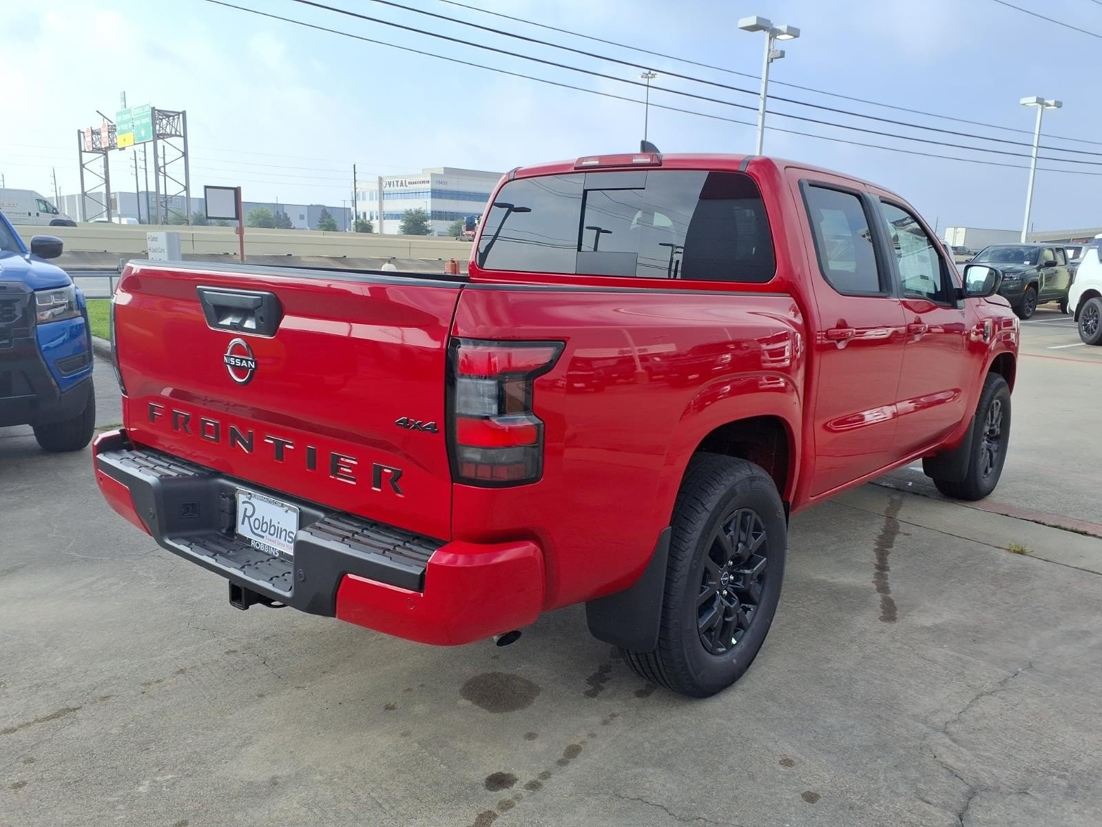 2026 Nissan Frontier SV Red at Robbins Nissan
