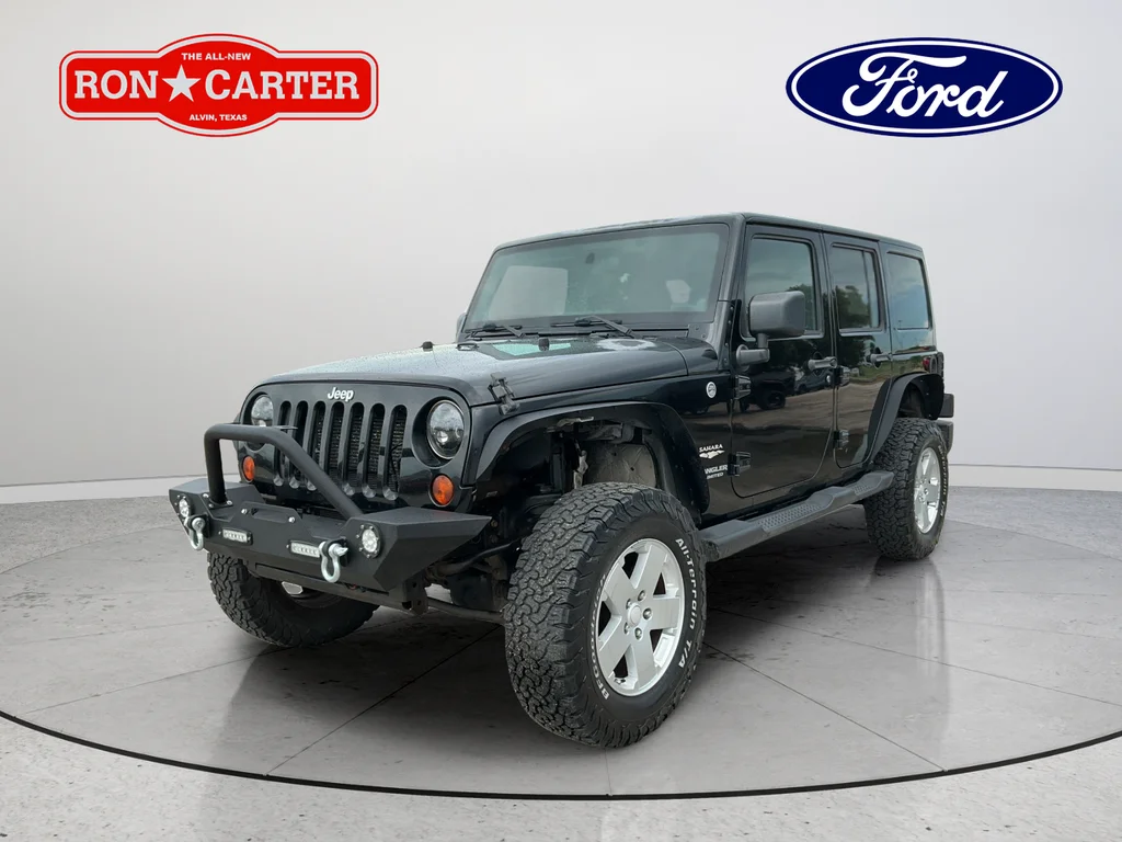 Used 2012 Black Jeep Unlimited Sahara image 3