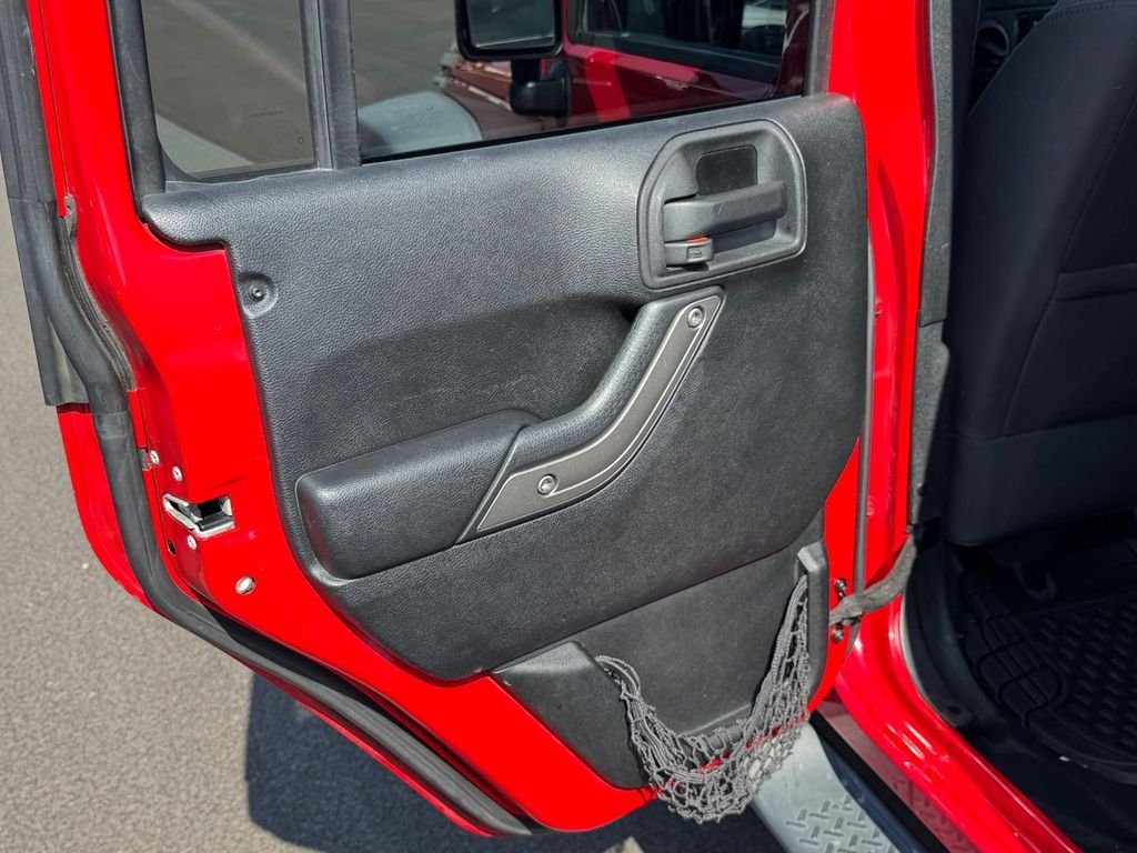 Used 2014 Red Jeep Unlimited Sport image 13